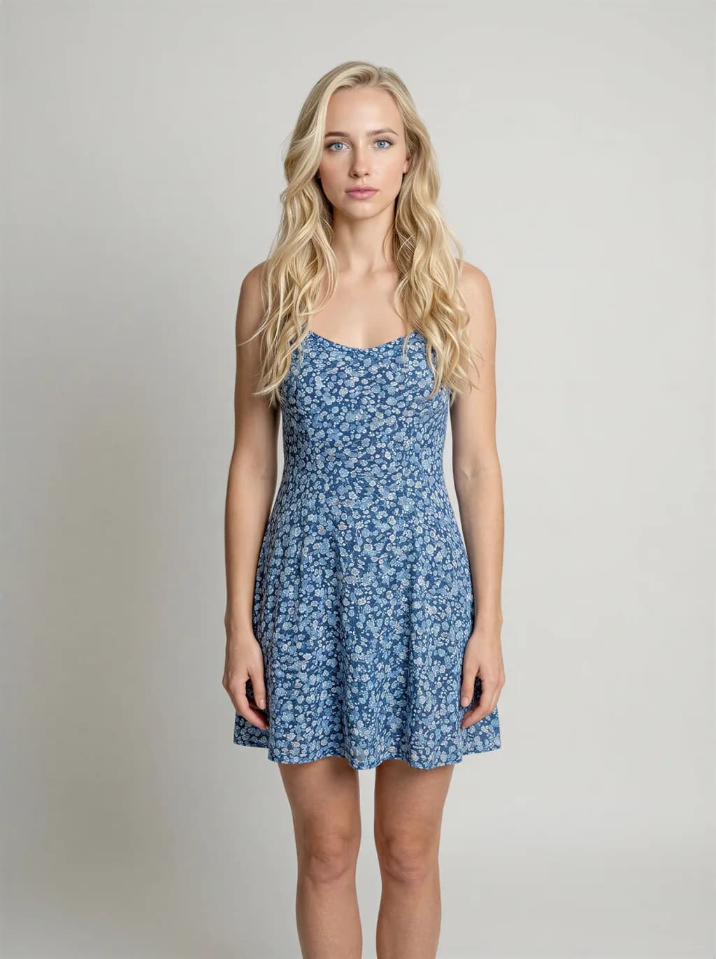 AI product model wearing a blue floral dress against a plain studio backdrop